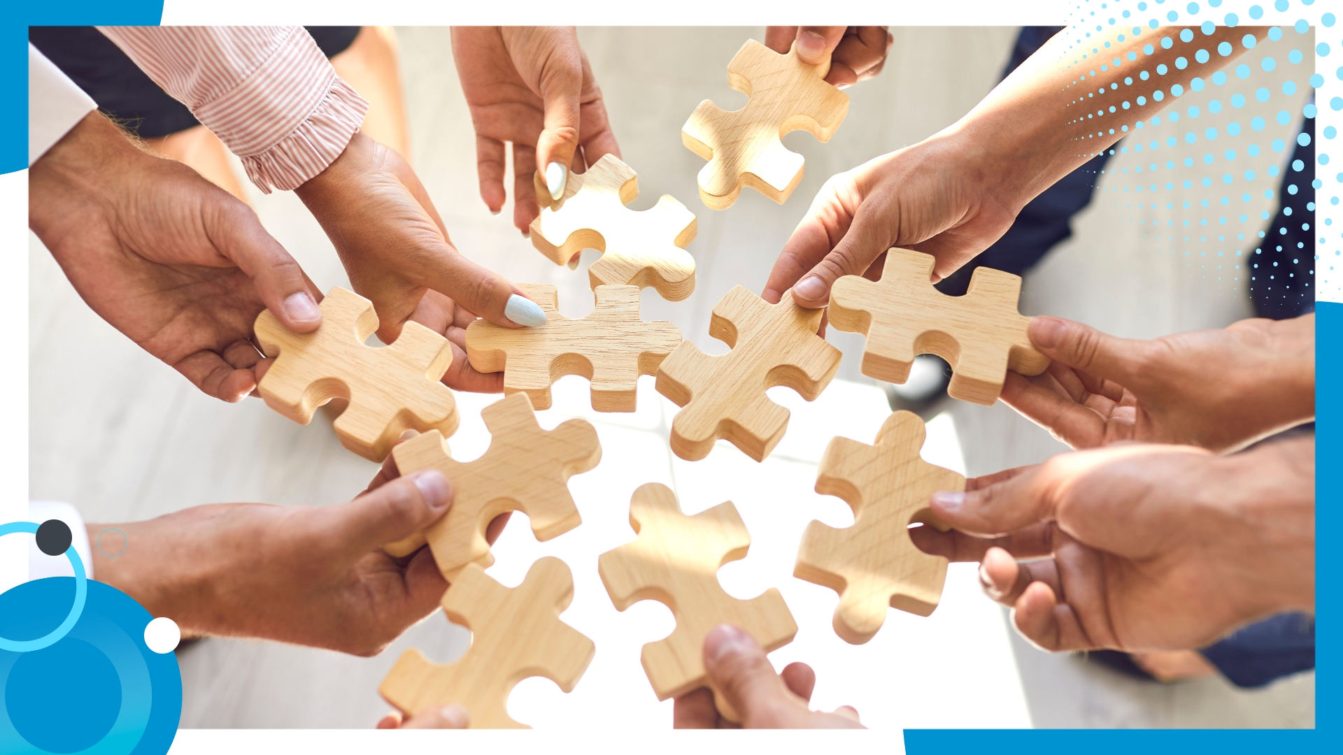 Multiple hands holding wooden puzzle pieces, symbolizing teamwork, collaboration, and collective problem-solving to achieve shared goals.